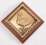 A Chatham Dockyard replica bronze ward room badge for HMS Black Swan on wooden plinth: 19cm high