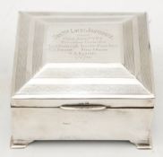 A WWI period silver presentation cigarette box: assays rubbed,
