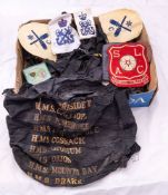 A group of Royal Navy hat tallies and shoulder badges: including HMS King George V, HMS Cambridge,