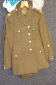 A collection of military uniform: including Tropical Dress, No 1 Dress, trench coat etc,
