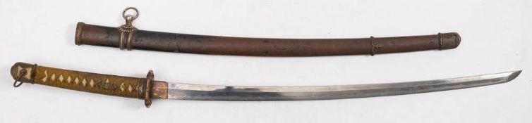 A WWII Japanese Katana: the blade with visible hamon,