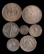 USA. Two 1897 dollars, 41/52 half dollars, a 1909 dime and an 1848 cent.