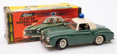 A Schuco Mercedes Benz 'Elektro Razzia Car 5509': lithograph interior with driver and radio
