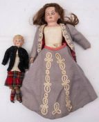 An Armand Marseille bisque shoulder headed doll: applied brown wig, blue glass sleeping eyes ,