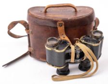 A pair of WWI military issue Prismatic binoculars in brown leather case date stamped 1916: together