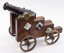 A 20th century iron signal cannon: the 11 inch four stage barrel with flared muzzle on an oak truck