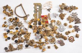 A collection of Regimental cap badges,: shoulder badges and buttons including RAF,