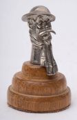 An early 20th century car mascot in the form of 'Old Bill': signed Bruce Bairnsfather to helmet,