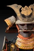 A Japanese Taisho Period O-yoroi (Samurai armour):, the kabuto with gilt brass mandate and mon,