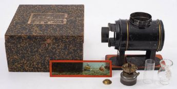 Ernst Plank (Germany) A 'Latern Magica' tinplate magic lantern: the black Russian lacquer body with