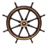 A 19th century teak and brass ship's helm:, with fluted, block and carved spars,