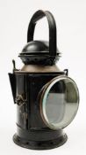 A GWR signal lamp: with oil burner a rotating red/blue shade,