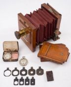 A mahogany and brass 'The International' three quarter plate camera by J Lancaster & Son,