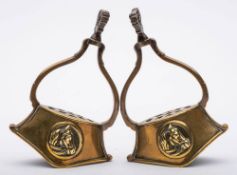 A pair of late Victorian/early Edwardian brass stirrups:,