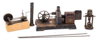 An Ernst Plank live steam horizontal assembly: with three inch spoked flywheel on a pressed tin