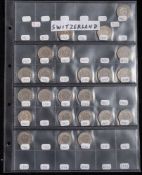 A collection of Swiss coins including silver: