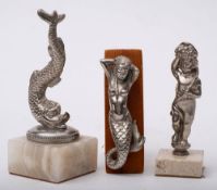 A Mermaid car mascot:, together with a Dolphin mascot and a Bacchic cherub mascot,