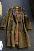 Two mid 20th century fur coats: together with a mink muff,