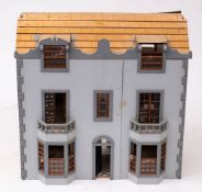 A dolls house in the Georgian style: together with a miscellaneous collection of dolls house