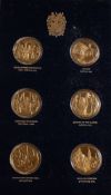 An Official John Pinches Churchill Commemorative album of 24 medals: gold plated on silver each 26g.