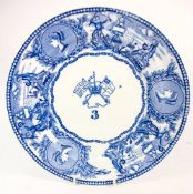 A Victorian blue and white Mess plate: 'young -head' pattern with central crossed flags and crown