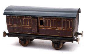 A Marklin Gauge 1 luggage van: maroon with gilt transfer coachlines.