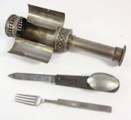 An early 20th century hand held campaign light: with sprung candle ejector to handle,