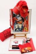 A collection of Ferrari and Formula 1 memorabilia: including a wheel nut,