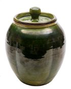 Tilly Young [Contemporary] a terracotta jar and cover: of lobed oviform under green glazes,