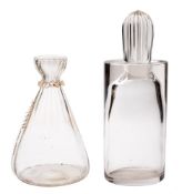 A clear glass decanter and a carafe: the form of Scandinavian influence and of oval profile with