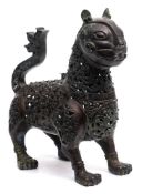 A Persian cast brass censer : in the form of a cat, with hinged neck and head,