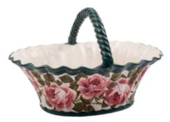 A large Wemyss pottery basket: of fluted oval form with rope twist handle,
