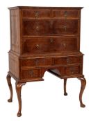 An 18th Century walnut and seaweed marquetry chest on stand: with foliate bandings bordered with