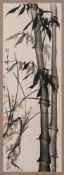 A Chinese painting of bamboo, signed Tao Xiang: depicting bamboo, rockwork and irises,