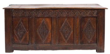 An early 18th Century oak rectangular coffer:, the plain hinged rectangular top with a moulded edge,