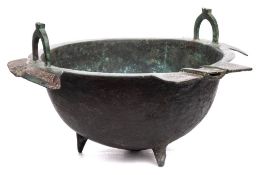An Islamic white metal inlaid bronze cooking pot.