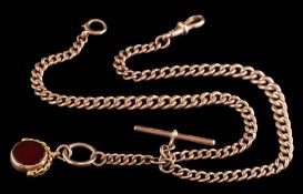 A 9ct gold graduated curb-link watch chain: with attached T-bar and 15ct gold mounted swivel seal,