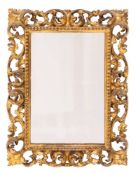 A late 19th Century Florentine carved giltwood rectangular mirror:,