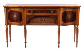 An Edwardian mahogany, banded and inlaid sideboard: of shaped front outline,