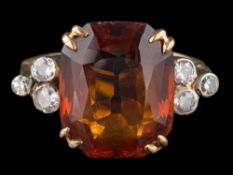 A rectangular citrine and diamond ring: the citrine approximately 13.5mm long x 11mm wide x 6.