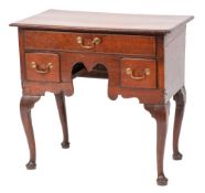 An 18th Century oak lowboy:, the rectangular top with a moulded edge,