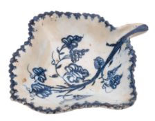 A Lowestoft blue and white leaf pickle dish: painted with a vine branch and grapes, serrated rim,