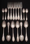 A collection of Continental white metal flatwares: includes dessert spoons, dessert forks,
