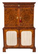 An early 18th Century reconstructed oyster and burr veneered walnut inlaid cabinet: in two sections,