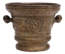 A bronze mortar in the 17th century taste: with garland and satyr mask banded decoration,