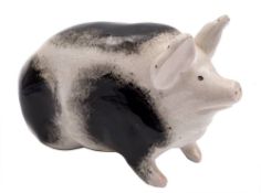 A Wemyss pottery pig: modelled in seated posture, with mottled grey markings,