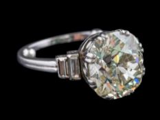 A diamond single-stone ring: with cushion-shaped modified old brilliant-cut diamond approximately