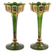 A pair of Bohemian green and white overlay glass lustre vases: of petal form,