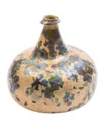 A green glass 'onion' wine bottle: the surface with iridescence, circa 1700,