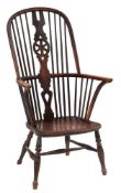 An early 19th Century elm and beech wheel and stick back Windsor elbow chair:,